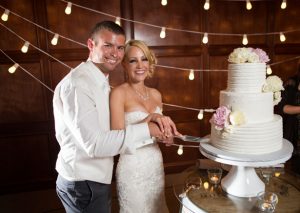 Wedding cake cutting - Three16 Photography