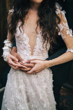Deep v-neck and lace wedding dress -Erika Layne Photography 
