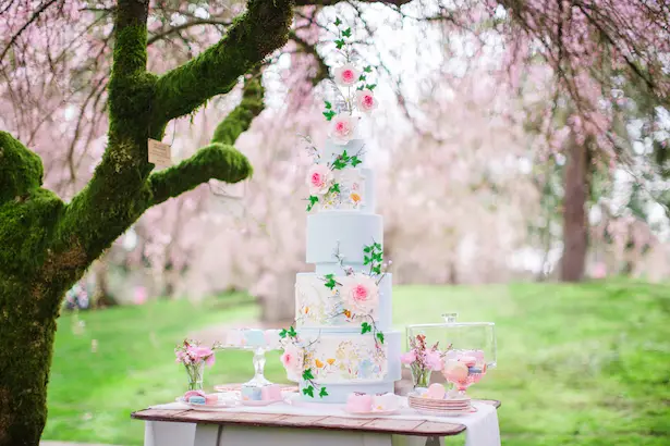 Dusty Blue Wedding cake with pink flowers - Caroline Ross Photography