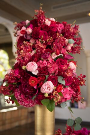 Red, pink and gold wedding centerpiece - Cary Diaz Photography