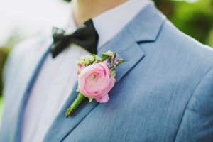 Pink groom boutonniere with light grey tuxedo- Caroline Ross Photography