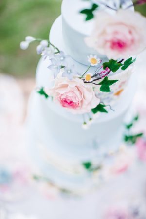 Dusty Blue Wedding cake with pink flowers - Caroline Ross Photography
