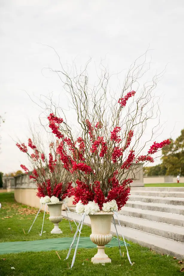Red wedding ceremony flowers - Cody Raisig Photography