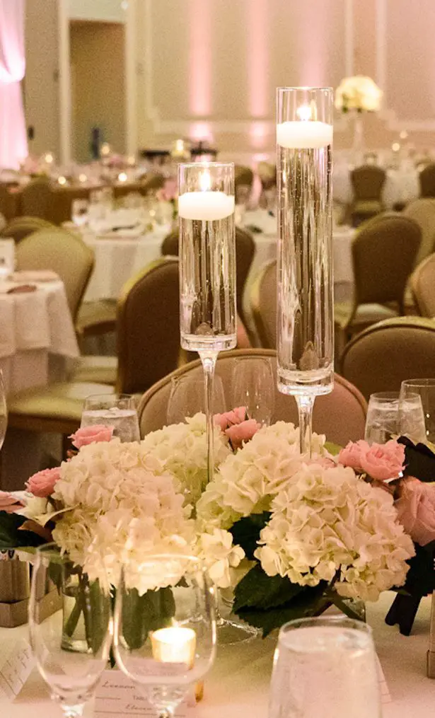 Pink and white wedding centerpiece with candles - Katie Whitcomb Photographers