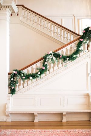 Wedding staircase decorated with floral garland- Lindsay Campbell Photography