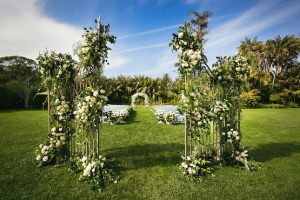 White and greenery outdoor wedding ceremony- Photography: Callaway Gable