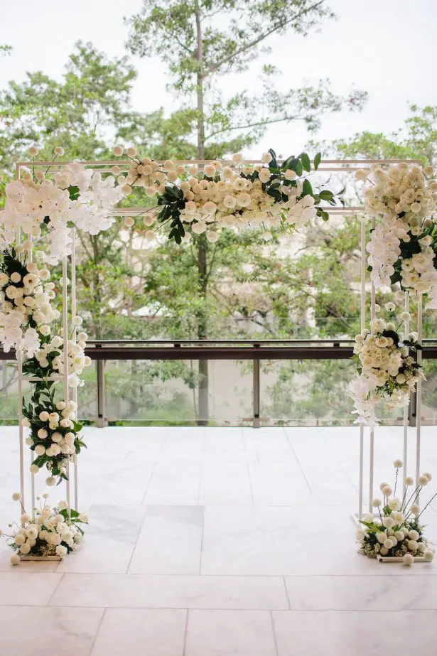 White wedding ceremony arch - Photography: Prue Franzman