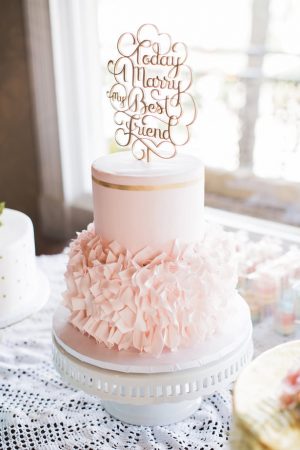 Blush and gold ruffled wedding cake with cake topper - Brooke Images