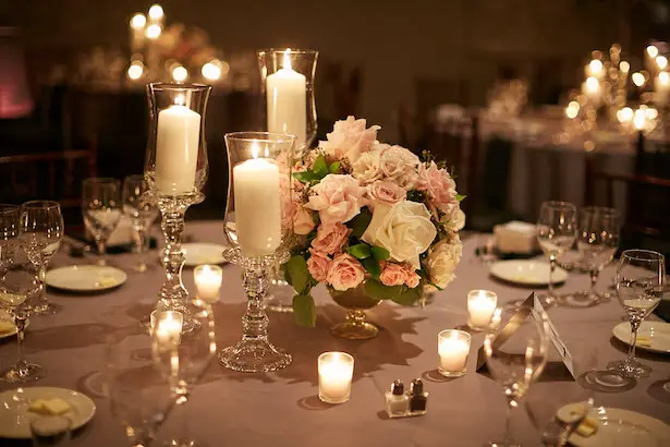 Elegant wedding centerpiece with roses and candles - Wasio Photography
