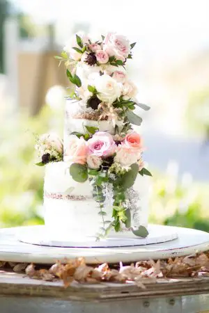 White naked wedding cake with blush roses and flowers - Janita Mestre Photography