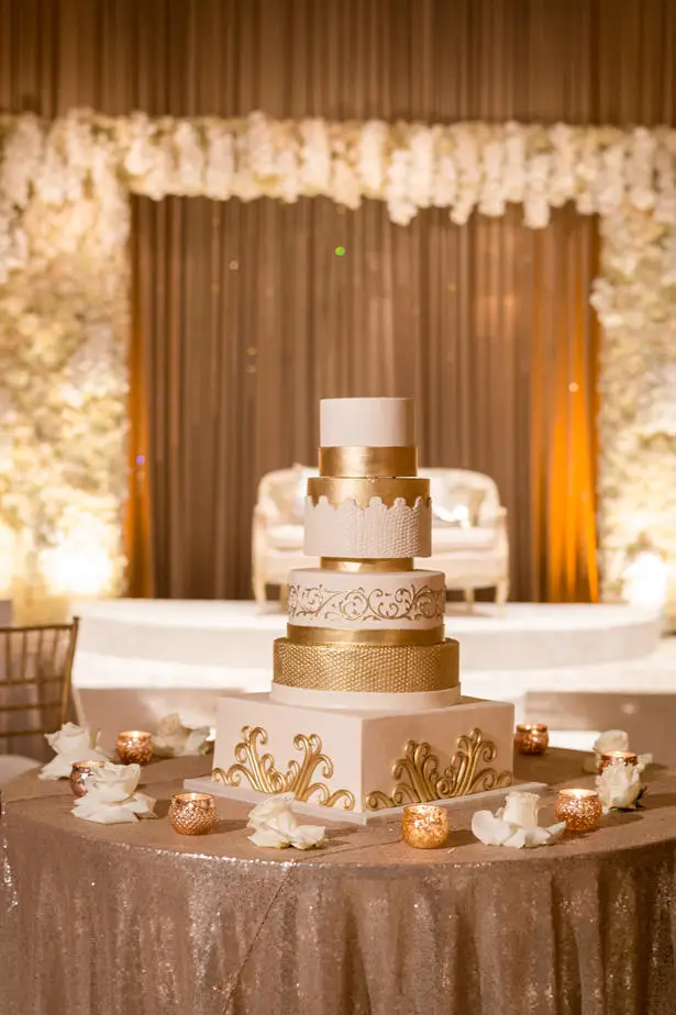 White and gold luxury wedding cake - Photographer: Julia Franzosa
