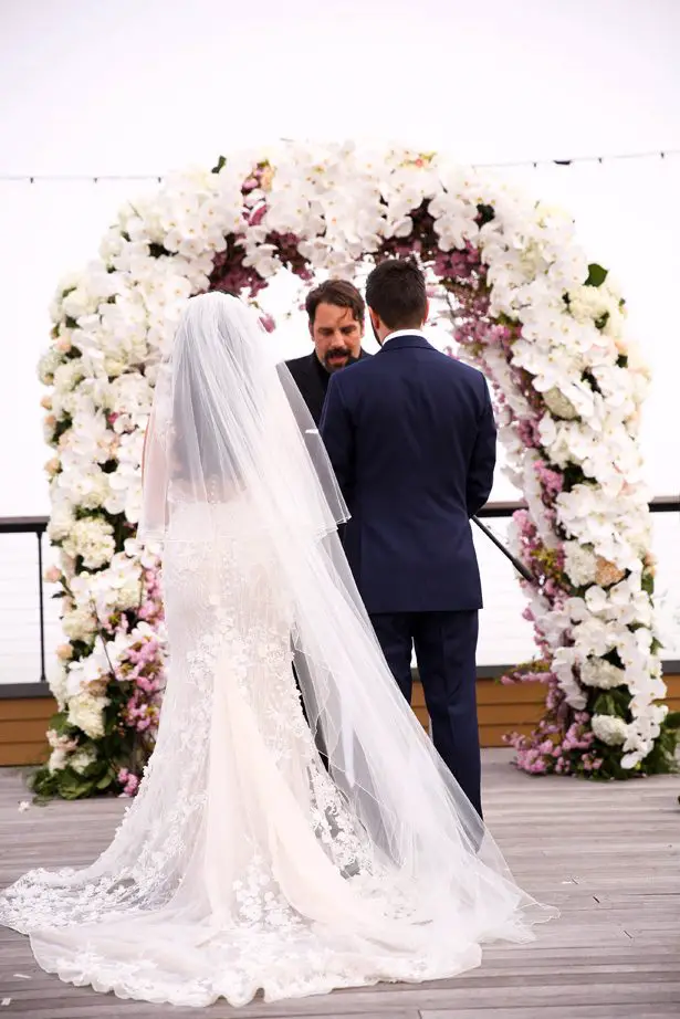 Floral Wedding ceremony arch - Photography: Adam Opris
