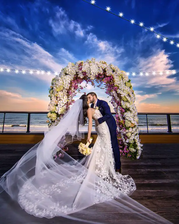 Floral Wedding ceremony arch - Photography: Adam Opris