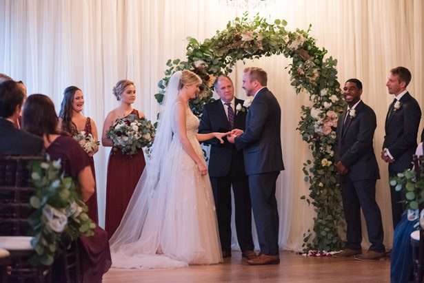Wedding ceremony decor with greenery arch - Photography by Marirosa