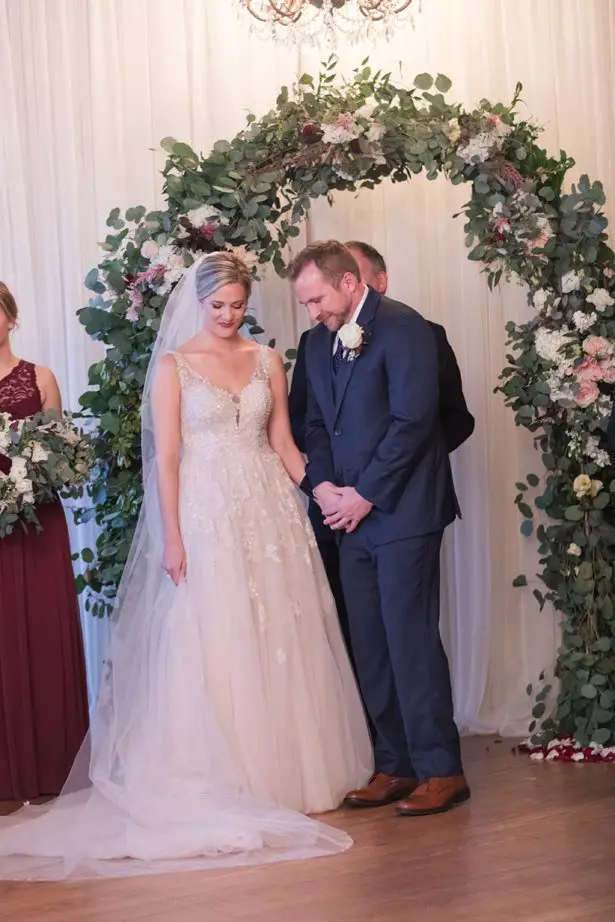 Wedding ceremony decor with greenery arch - Photography by Marirosa