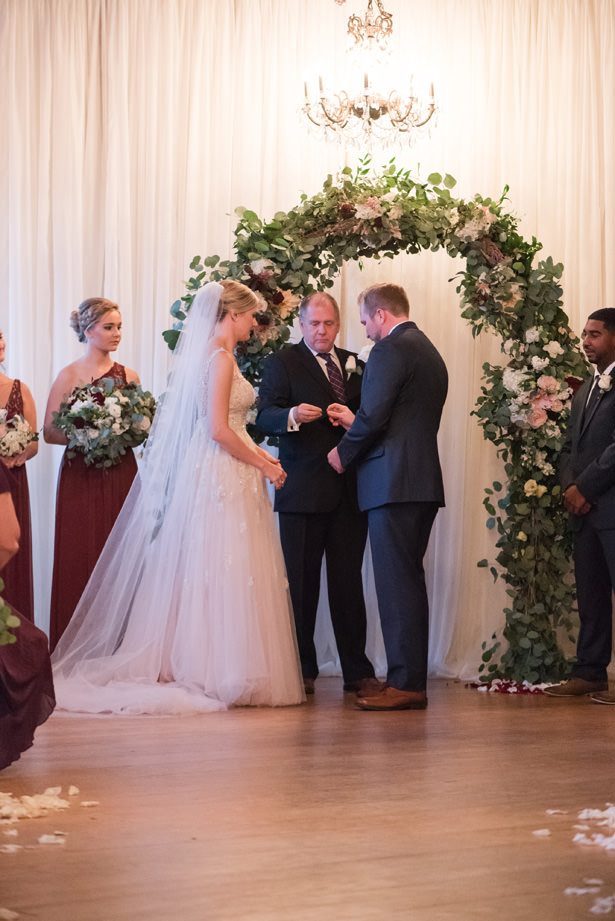 Wedding ceremony decor with greenery arch - Photography by Marirosa