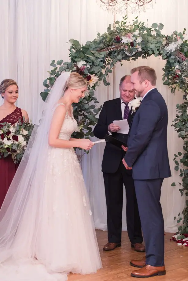 Wedding ceremony decor with greenery arch - Photography by Marirosa