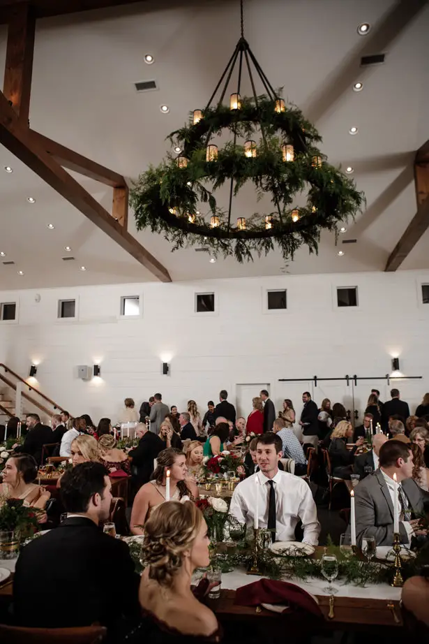 pine branches and burgundy hues for an elegant winter wedding