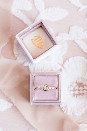 Gold engagement ring on a blush velvet ring box - Lynne Reznick Photography