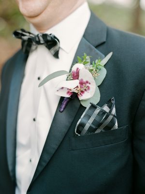 Groom black and white suit with purple boutonniere - Melissa Schollaert Photography