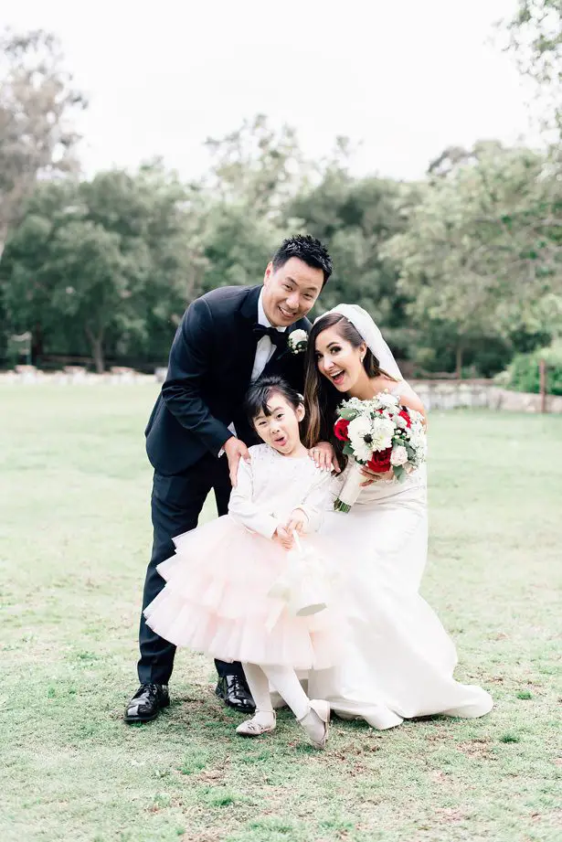 weddilng couple with flower girl - XO and Fetti Photography