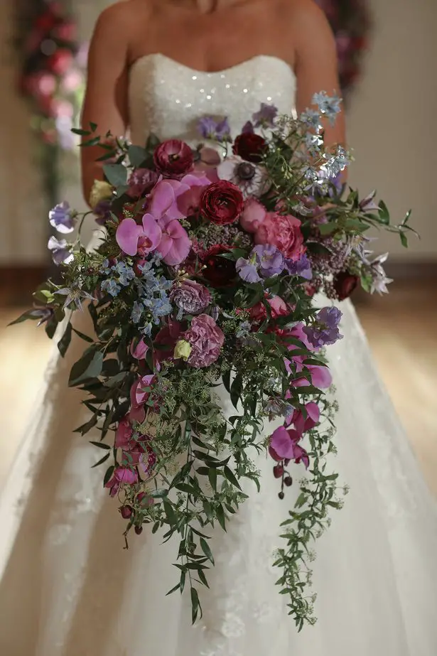 Cascading purple wedding bouquet -Sherri Barber Photography