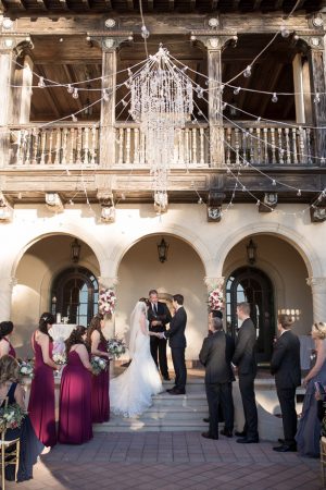 Outdoor burgundy wedding ceremony decor with crystal chandelier- Cat Pennenga Photography