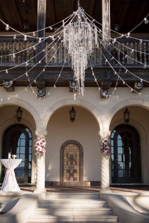 Outdoor wedding ceremony decor with crystal chandelier- Cat Pennenga Photography