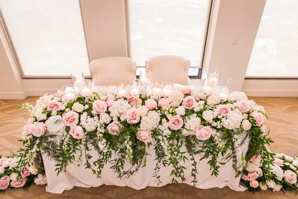 Garland wedding centerpiece with pink and white flowers for sweetheart table -Classic Blush Wedding at The Houston Club - Nate Messarra Photography