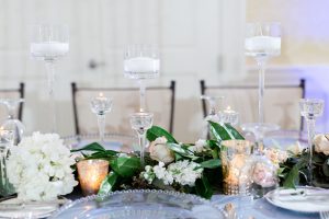 Wedding centerpiece table garland with candles - Luke & Ashley Photography