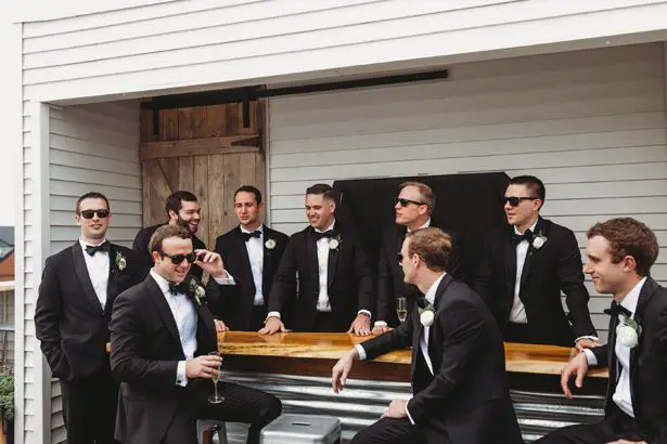 Groomsmen in black classic tuxedos - Mann and Wife Photography