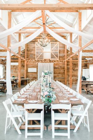 Long wedding tablescape at a rustic reception - Bobbye Jean Photography