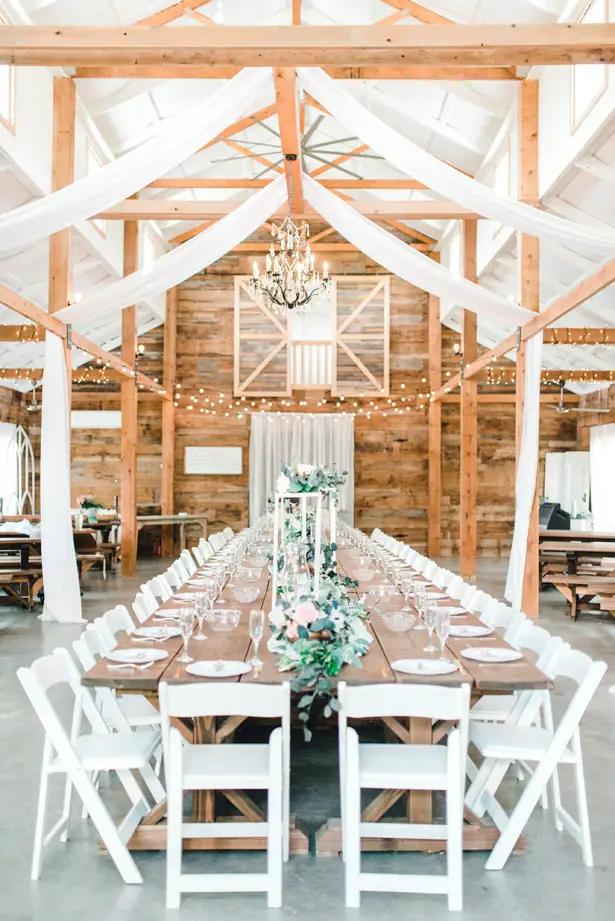 Long wedding tablescape at a rustic reception - Bobbye Jean Photography