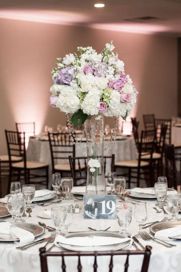 Tall wedding centerpiece with classic floral design, and white and lavender flowers- Lynne Reznick Photography