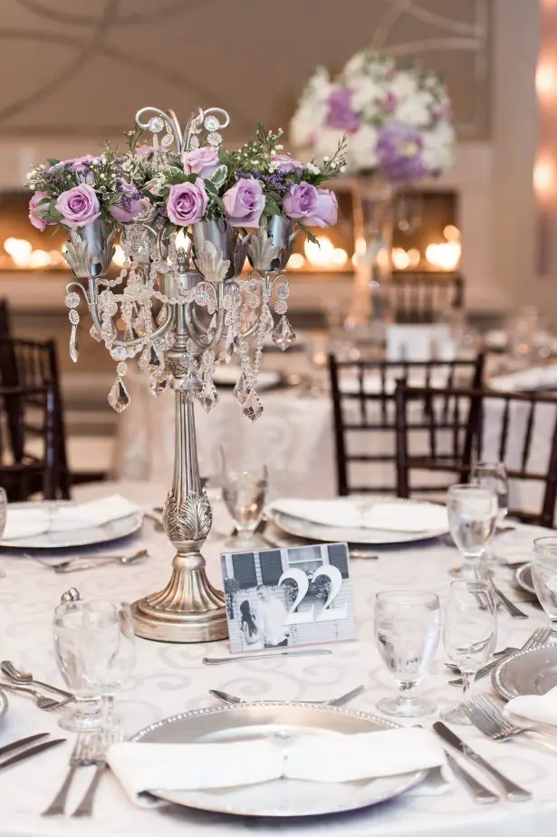 Tall candelabra wedding centerpiece with lavender flowers - Lynne Reznick Photography