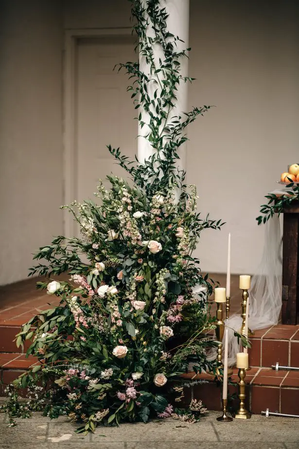 Floral wedding ceremony decor with greenery and candles - Amanda Meg Photography