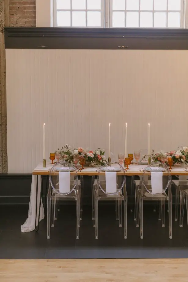 Long Wedding tablescape with modern acrylic chairs - Andrea Zajonc Photography