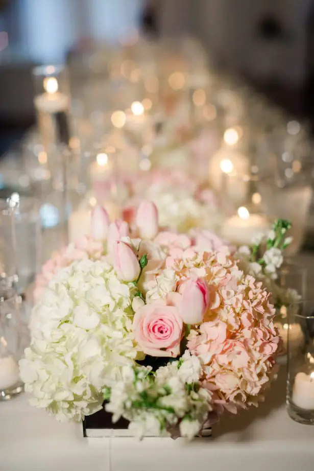 Low wedding centerpiece with candlelight for long table - Krystle Akin Photography