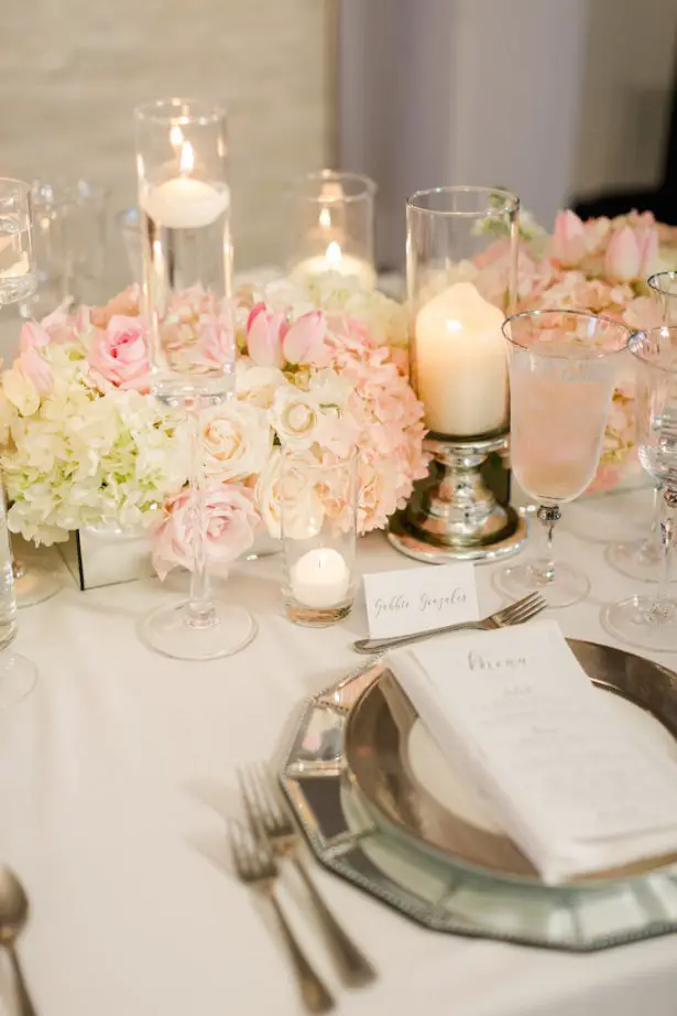 Low blush wedding centerpiece with candlelight and mirror place setting - Krystle Akin Photography