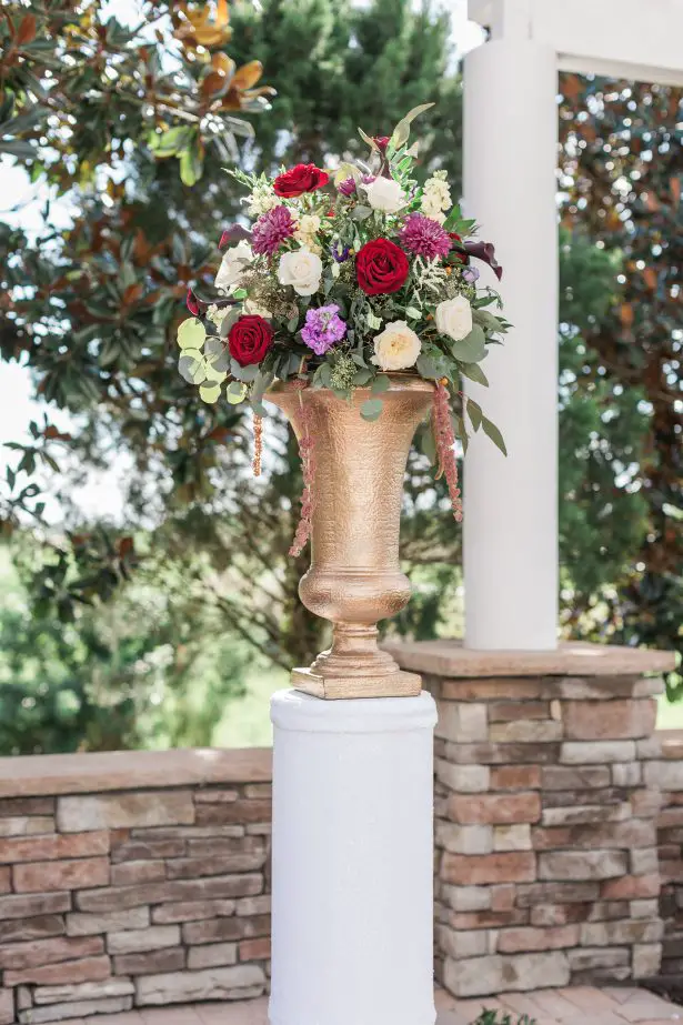 Colorful wedding ceremony flowers with gold vase - Photography: The Hendricks 