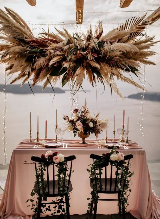 Pampas grass wedding decor with sweetheart table - Phosart Photography