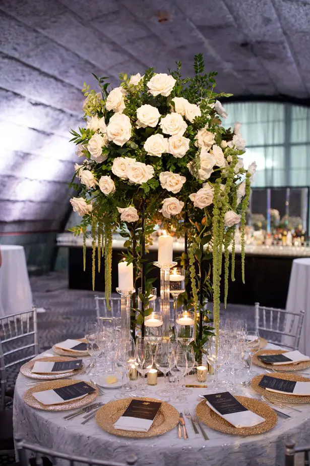Round wedding tablescape with tall wedding centerpiece- Rafal Ostrowski Photography