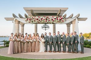 Glittery rose gold bridesmaids dresses and grey groom suit bridal party photo A Glamorous Wedding with Fireworks - Rachael Hall Photography