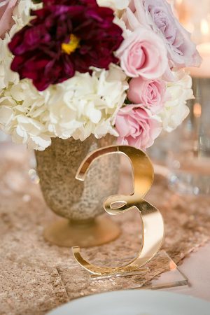 Gold table number for reception A Glamorous Wedding with Fireworks - Rachael Hall Photography