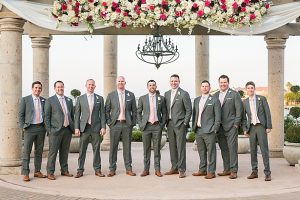 Grey groomsmen suits with pink ties A Glamorous Wedding with Fireworks - Rachael Hall Photography