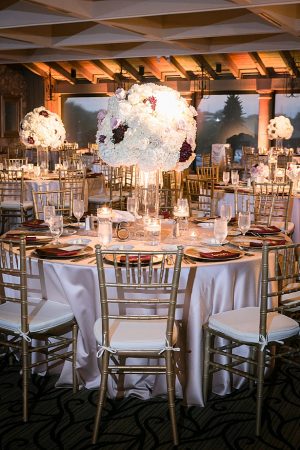 Luxurious flower centerpieces for wedding reception A Glamorous Wedding with Fireworks - Rachael Hall Photography