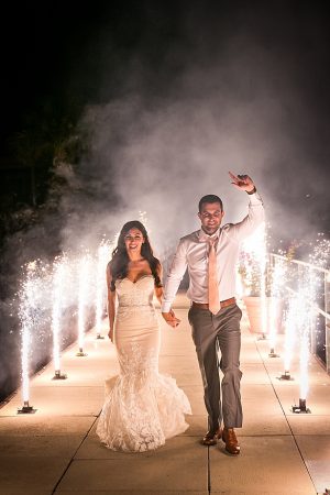 Romantic wedding exit with bride and groom A Glamorous Wedding with Fireworks - Rachael Hall Photography