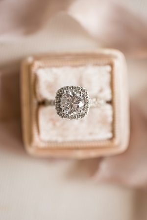 Stunning round engagement ring with square halo A Glamorous Wedding with Fireworks - Rachael Hall Photography