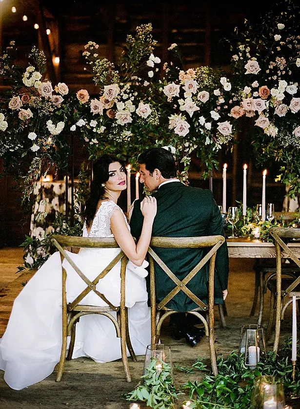 bride and groom at reception table Barn Wedding - Twah Photography