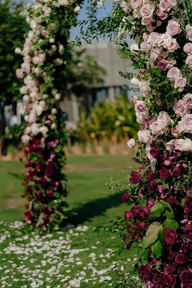 Blush and burgundy wedding floral arch - Madiow Photography